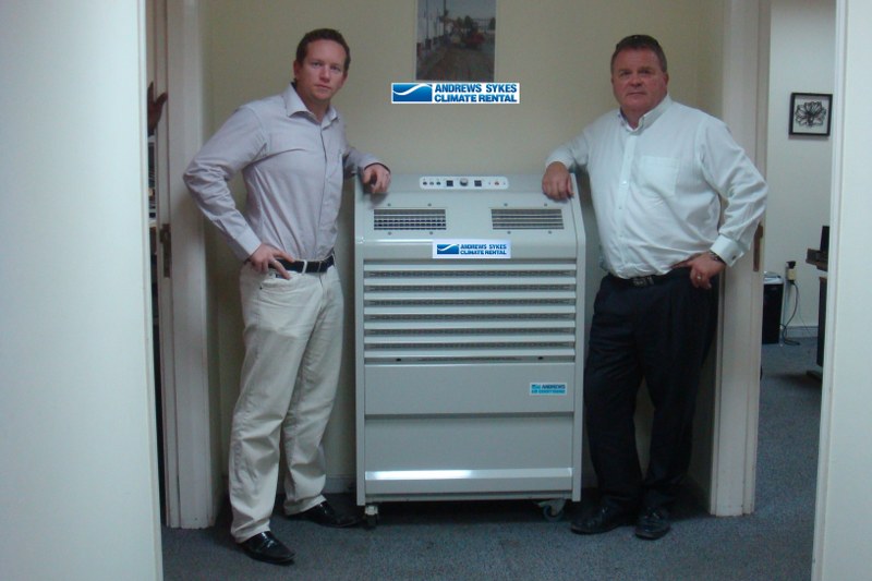 dc_cw_800x5331 High quality temporary air conditioning hire from Andrews Sykes Climate Rental Middle East LLC (GM - Clinton Wyngard together with Dave Crawford – Khansaheb Sykes GM standing next to a PAC22 - one of the high capacity portable air conditioning units within the rental fleet.