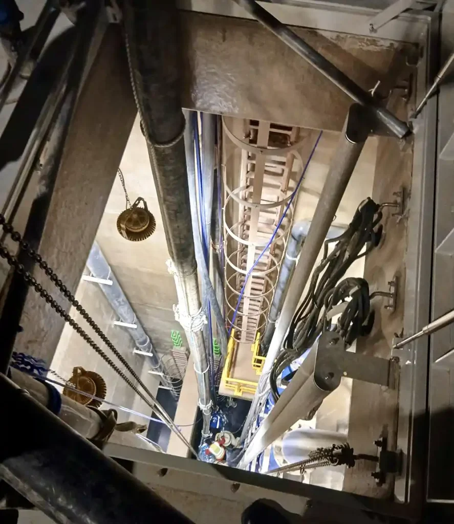 Looking down into the 20m deep chamber, showing the depth and complexity of the vertical lift challenge